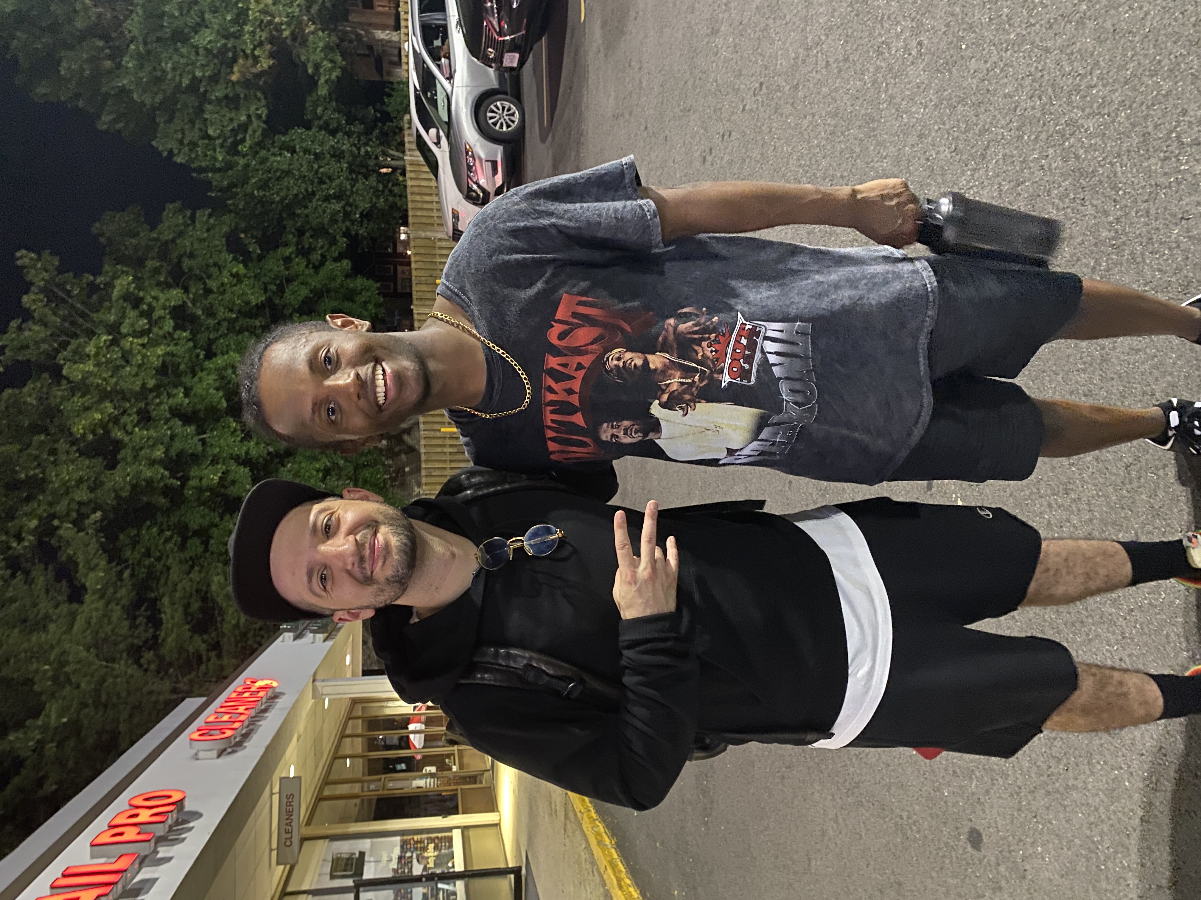 Meni with choreographer Nick DeMoura at a dance event, June 2022.